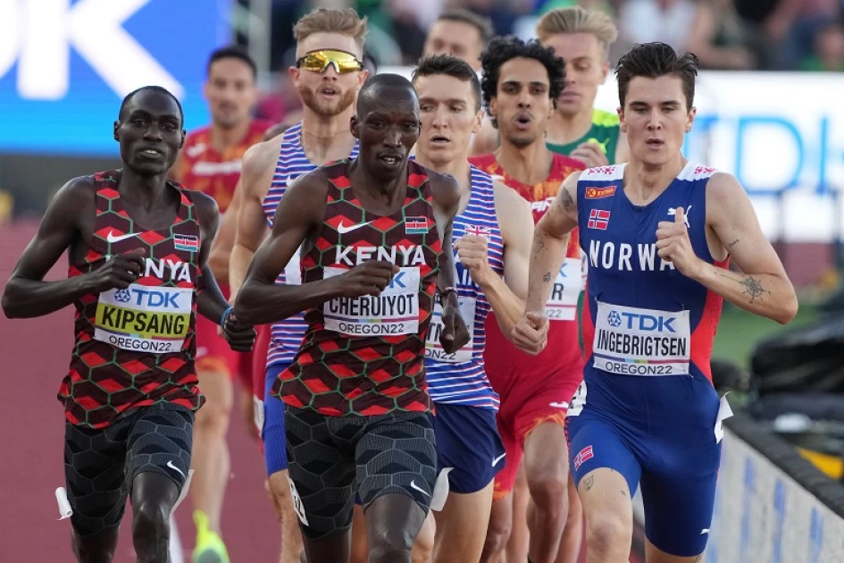 Jul 19, 2022; Eugene, Oregon, USA; Jakob Ingebrigtsen (NOR), right, leads the pack, including Abel Kipsang (KEN), left, and Timothy Cheruiyot (KEN), center, in the men's 1500m final during the World Athletics Championships Oregon 22 at Hayward Field.